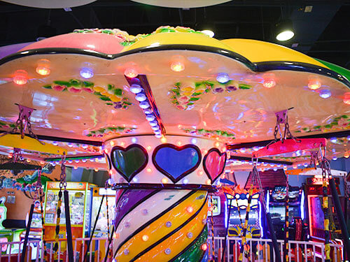 swing amusement ride with colorful lights